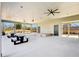 Spacious covered patio with ceiling fans, picnic tables, and an outdoor stage area at 83 Arnold Poplar Ln, Auburn, GA 30011