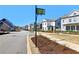 Street view of modern townhomes, showcasing community layout and landscaping at 83 Arnold Poplar Ln, Auburn, GA 30011