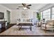 A modern living room features hardwood floors, recessed lighting, and natural light at 1031 Willivee Dr, Decatur, GA 30033