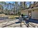 An outdoor patio area features stone pavers and a patio table set, perfect for outdoor dining at 1031 Willivee Dr, Decatur, GA 30033