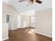 A bright bedroom offers hardwood floors, a ceiling fan, and neutral paint at 1477 Akridge Nw St, Atlanta, GA 30314
