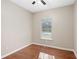 Bedroom featuring hardwood floors, ceiling fan, and one bright window at 1477 Akridge Nw St, Atlanta, GA 30314