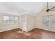 Corner bedroom featuring two windows, hardwood floors and a ceiling fan at 1477 Akridge Nw St, Atlanta, GA 30314