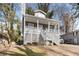 Charming home with a covered front porch and well-maintained yard at 1477 Akridge Nw St, Atlanta, GA 30314