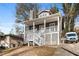 Home featuring a covered front porch and a private driveway at 1477 Akridge Nw St, Atlanta, GA 30314