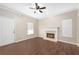 Open-concept living room with fireplace, tile flooring, and natural light at 1477 Akridge Nw St, Atlanta, GA 30314