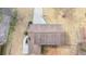 Aerial shot highlighting the home's roof and exterior details, set against a natural backdrop at 2167 Cedar Dr, Lawrenceville, GA 30043