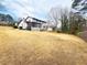 Spacious backyard with a screened-in porch, ideal for outdoor entertaining and enjoying the natural surroundings at 2167 Cedar Dr, Lawrenceville, GA 30043