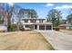 Charming two-story home featuring a two-car garage and well-maintained landscaping, perfect for suburban living at 2167 Cedar Dr, Lawrenceville, GA 30043
