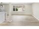 Bright, open living room with hardwood floors and a large window providing natural light at 2167 Cedar Dr, Lawrenceville, GA 30043