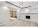 Living room with a fireplace and a sliding glass door leading to a sunroom at 2167 Cedar Dr, Lawrenceville, GA 30043