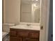 Cozy bathroom showcasing a white sink and vanity, with a toilet and shower at 2173 Wellington Cir, Lithonia, GA 30058