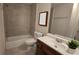 Cozy bathroom featuring a shower, white sink and vanity with a plant at 2173 Wellington Cir, Lithonia, GA 30058