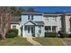 Charming townhouse featuring a quaint entryway and well-maintained landscaping at 2173 Wellington Cir, Lithonia, GA 30058