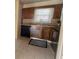 Well-lit kitchen featuring ample cabinet space and modern black appliances at 2173 Wellington Cir, Lithonia, GA 30058