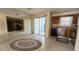 Open kitchen area featuring tile floor, mirrored wall and sliding glass door at 2173 Wellington Cir, Lithonia, GA 30058