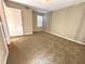 Neutral bedroom featuring wall-to-wall carpet and natural light from a window with white blinds at 406 Hawkstone Way, Alpharetta, GA 30022