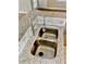 Close-up of the kitchen sink featuring granite countertops and a modern, stainless steel faucet at 406 Hawkstone Way, Alpharetta, GA 30022