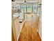 Open concept living space showcasing hardwood floors, granite countertops, and natural light at 406 Hawkstone Way, Alpharetta, GA 30022