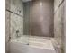Modern bathtub with tiled walls and glass door at 850 Piedmont Ne Ave # 1302, Atlanta, GA 30308