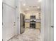 Eat-in kitchen with stainless steel appliances and stone tile flooring at 850 Piedmont Ne Ave # 1302, Atlanta, GA 30308