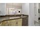 Kitchen with stainless steel appliances and granite countertops looking into living room at 850 Piedmont Ne Ave # 1302, Atlanta, GA 30308