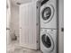 Laundry closet with a stacked washer and dryer unit at 850 Piedmont Ne Ave # 1302, Atlanta, GA 30308
