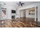Open layout living room featuring fireplace, hardwood floors, and view of kitchen at 850 Piedmont Ne Ave # 1302, Atlanta, GA 30308