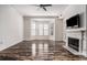 Living room featuring hardwood floors, fireplace, and large windows at 850 Piedmont Ne Ave # 1302, Atlanta, GA 30308