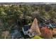 An aerial view shows a home surrounded by lush trees, offering a secluded feel at 993 Northrope Ne Dr, Atlanta, GA 30324