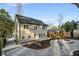 Back of house featuring patio, landscaped yard, and outdoor fire pit at 993 Northrope Ne Dr, Atlanta, GA 30324