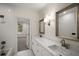 Modern bathroom features double vanity, marble countertops, white subway tile and access to another room at 993 Northrope Ne Dr, Atlanta, GA 30324