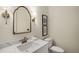 Chic powder room with marble countertop, vintage fixtures and leaf print artwork at 993 Northrope Ne Dr, Atlanta, GA 30324