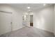 Carpeted bedroom leading to bathroom featuring ceiling fan and white walls at 993 Northrope Ne Dr, Atlanta, GA 30324
