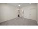 Spacious bedroom with neutral carpet, white walls, and doorways to the ensuite and hallway at 993 Northrope Ne Dr, Atlanta, GA 30324
