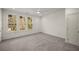 Bedroom with neutral carpet and three sunny windows at 993 Northrope Ne Dr, Atlanta, GA 30324