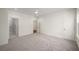 Bedroom with doorways to both the ensuite and hallway, neutral carpet, and white walls at 993 Northrope Ne Dr, Atlanta, GA 30324