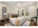Comfortable bedroom with neutral tones, two windows and elegant decorations at 993 Northrope Ne Dr, Atlanta, GA 30324