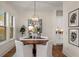 Inviting dining room featuring a modern light fixture and views of the outdoors at 993 Northrope Ne Dr, Atlanta, GA 30324