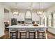 Modern kitchen with white cabinetry, a large island, pendant lighting, and stainless steel appliances, perfect for cooking at 993 Northrope Ne Dr, Atlanta, GA 30324