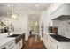 Well-lit kitchen showcasing a stainless steel sink, marble countertops, and hardwood flooring at 993 Northrope Ne Dr, Atlanta, GA 30324