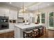 Bright kitchen featuring a large island with seating and modern appliances at 993 Northrope Ne Dr, Atlanta, GA 30324