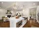 Open kitchen layout with a central island, flowing into a living room with fireplace at 993 Northrope Ne Dr, Atlanta, GA 30324