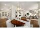 Well-lit living room offering views of the dining room and kitchen at 993 Northrope Ne Dr, Atlanta, GA 30324