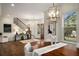 Cozy living room featuring staircase, natural light, and modern decor at 993 Northrope Ne Dr, Atlanta, GA 30324
