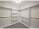 Well-organized walk-in closet with ample shelving and rod space provides plenty of storage at 993 Northrope Ne Dr, Atlanta, GA 30324