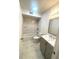 Updated bathroom features modern vanity, and shower with marble tile surround at 3078 Parc Lorraine, Lithonia, GA 30038