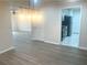 Inviting dining room featuring sleek hardwood floors, and chandelier, flowing into the kitchen at 3078 Parc Lorraine, Lithonia, GA 30038
