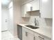Bright kitchen features white cabinetry, stainless steel appliances, and a stylish subway tile backsplash at 3078 Parc Lorraine, Lithonia, GA 30038
