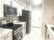 Modern kitchen featuring stainless steel appliances, white cabinets, and stylish countertops at 3078 Parc Lorraine, Lithonia, GA 30038